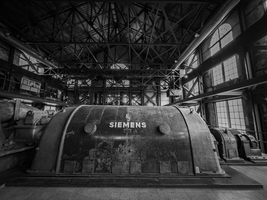 Black and white photo of Siemens machinery in an old factory, showcasing industrial heritage.